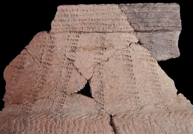 Close-up of a Shepard typical cord-wrapped dowel impressed mended rim and body sherds from the Winslow site 18MO9 - SI Cat. #449644 - Courtesy of the Smithsonian Institution, Museum of Natural History, Department of Anthropology.